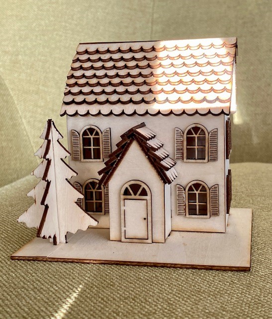wooden miniature two story house with a tree